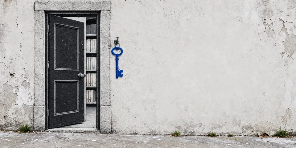 Conceptual mural of an institutional doorway and a blue key.